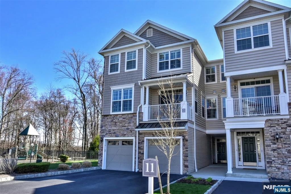 28 Autumn Way, Unit 72 Montvale, NJ 07645 - Photo 1 of 34 a front view of a house with a yard