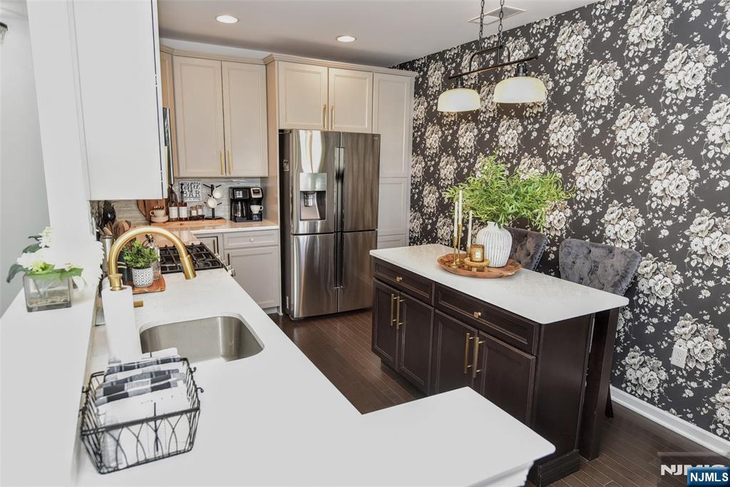 28 Autumn Way, Unit 72 Montvale, NJ 07645 - Photo 13 of 34 a kitchen with a sink a refrigerator and a stove