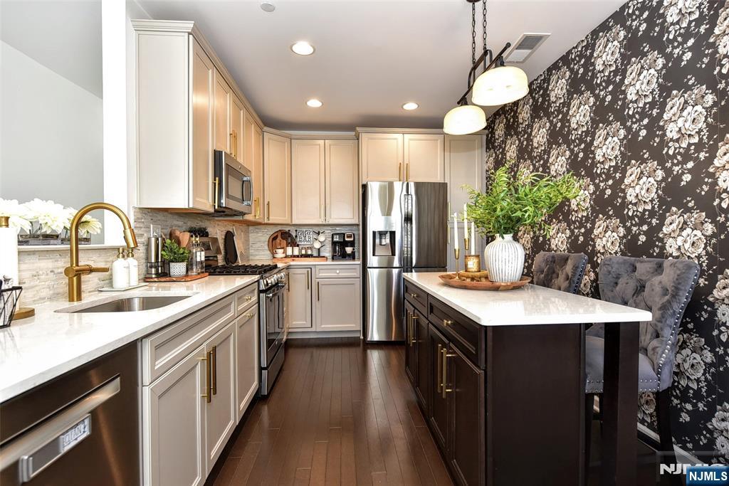 28 Autumn Way, Unit 72 Montvale, NJ 07645 - Photo 14 of 34 a kitchen with a sink stove and refrigerator