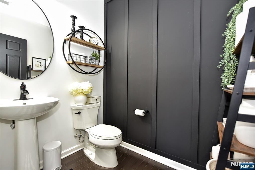 28 Autumn Way, Unit 72 Montvale, NJ 07645 - Photo 18 of 34 a bathroom with a toilet a sink and a mirror