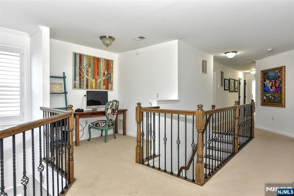28 Autumn Way, Unit 72 Montvale, NJ 07645 - Photo 23 of 34 a view of a hallway with workspace and a window