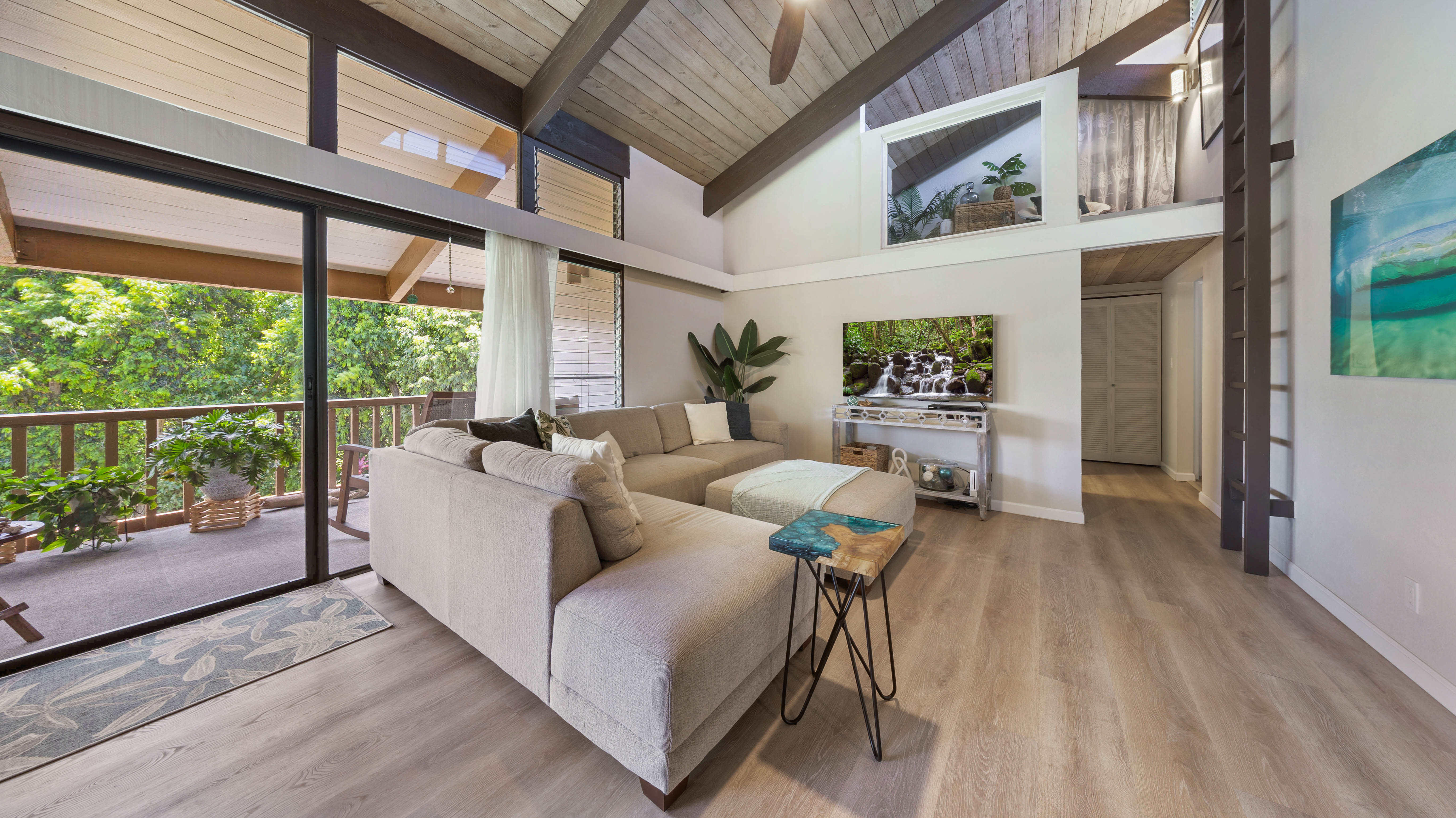 4701 Kawaihau Road, Unit L201 Kapaa, HI 96746 - Photo 1 of 29 a living room with furniture and a large window