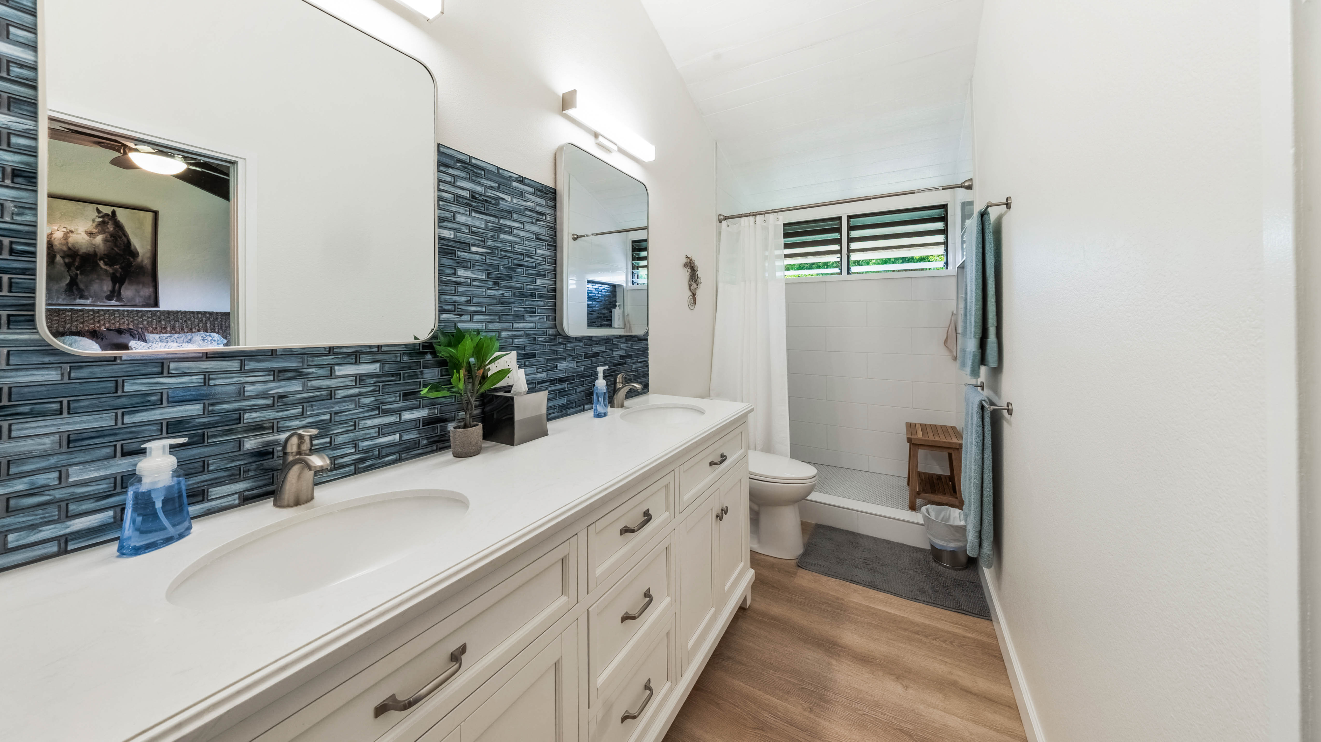 4701 Kawaihau Road, Unit L201 Kapaa, HI 96746 - Photo 13 of 29 a bathroom with a double vanity sink mirror and toilet