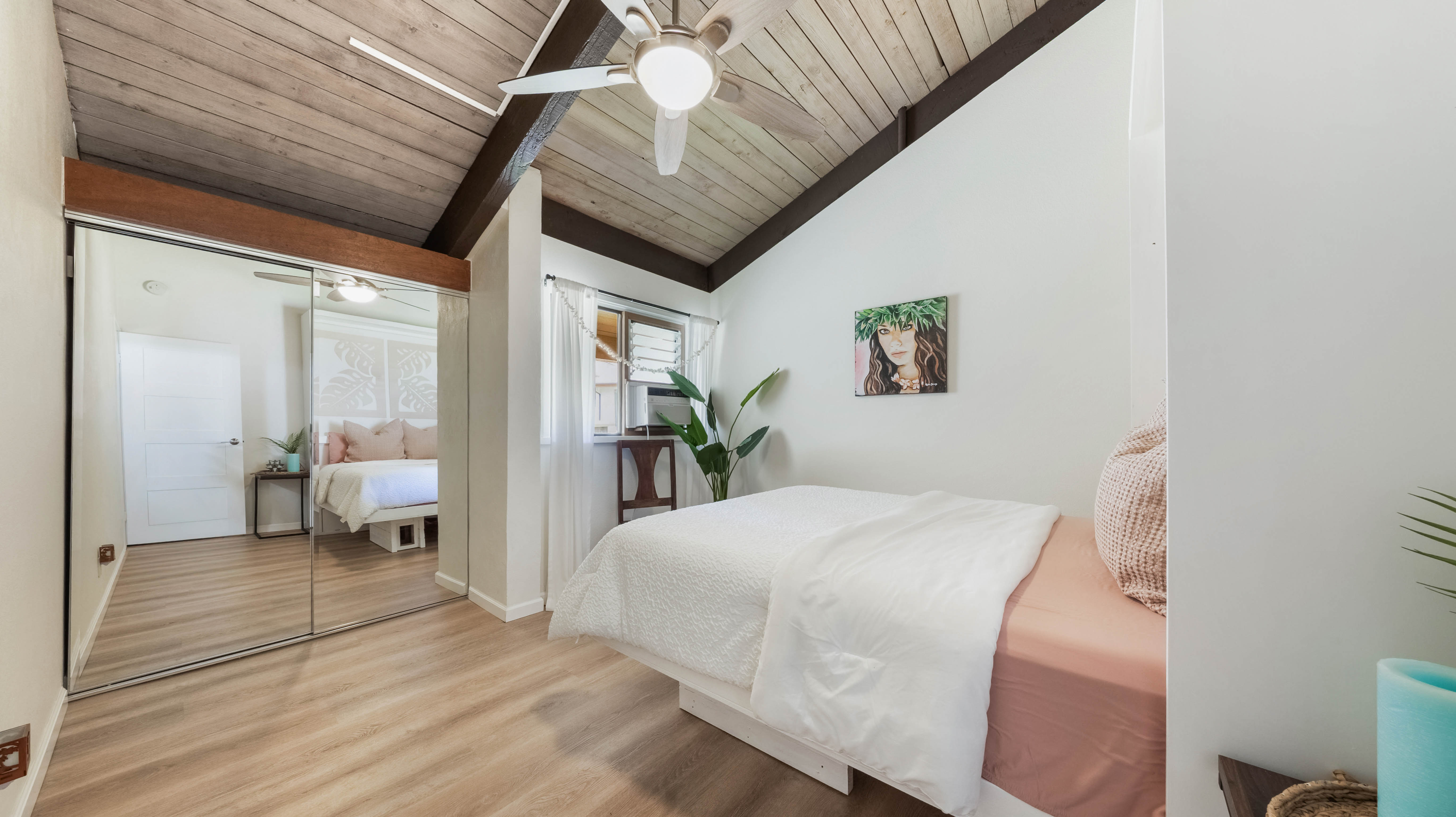 4701 Kawaihau Road, Unit L201 Kapaa, HI 96746 - Photo 16 of 29 a bedroom with a large bed and a large window