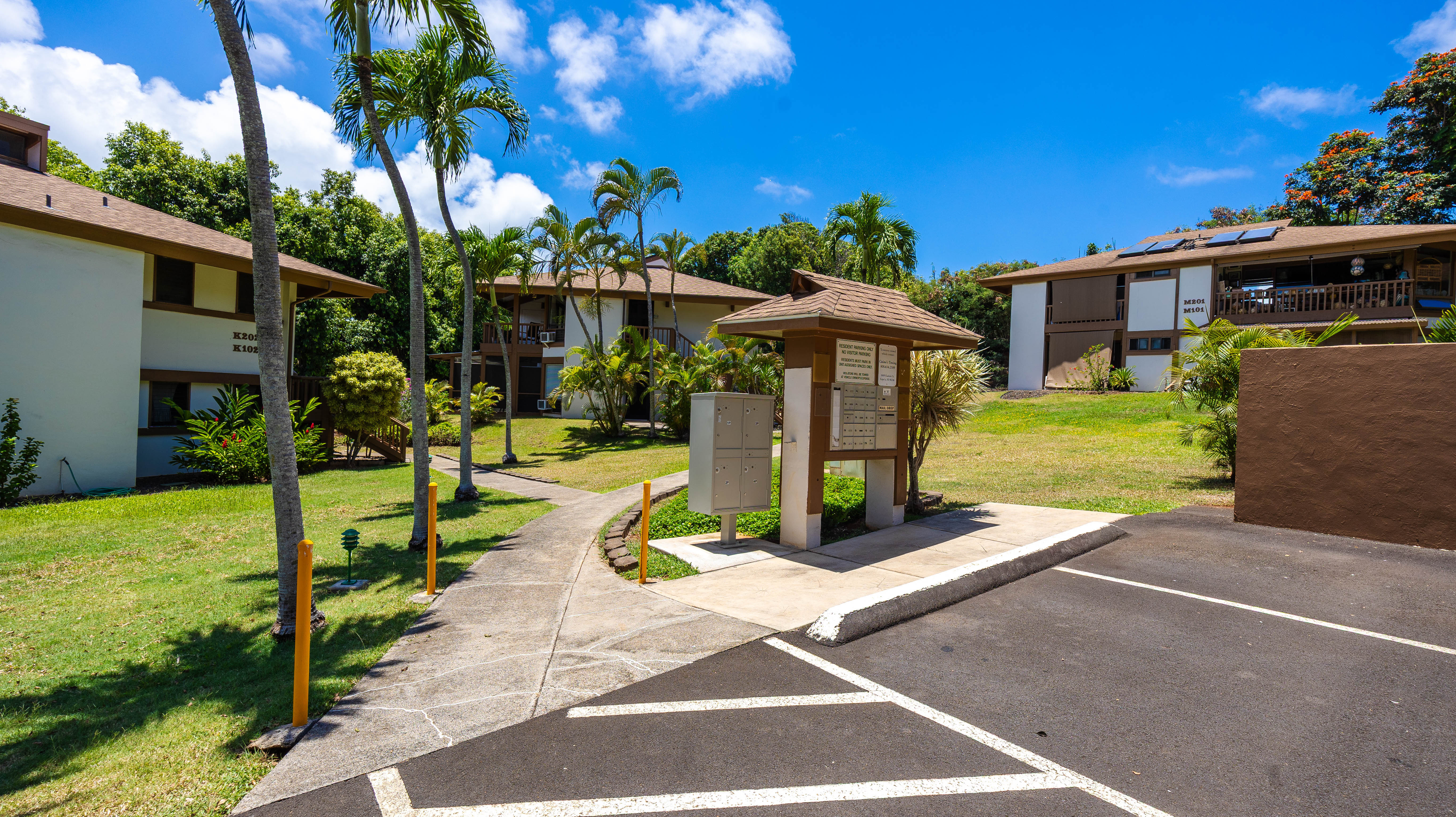 4701 Kawaihau Road, Unit L201 Kapaa, HI 96746 - Photo 24 of 29 a front view of a house with garden