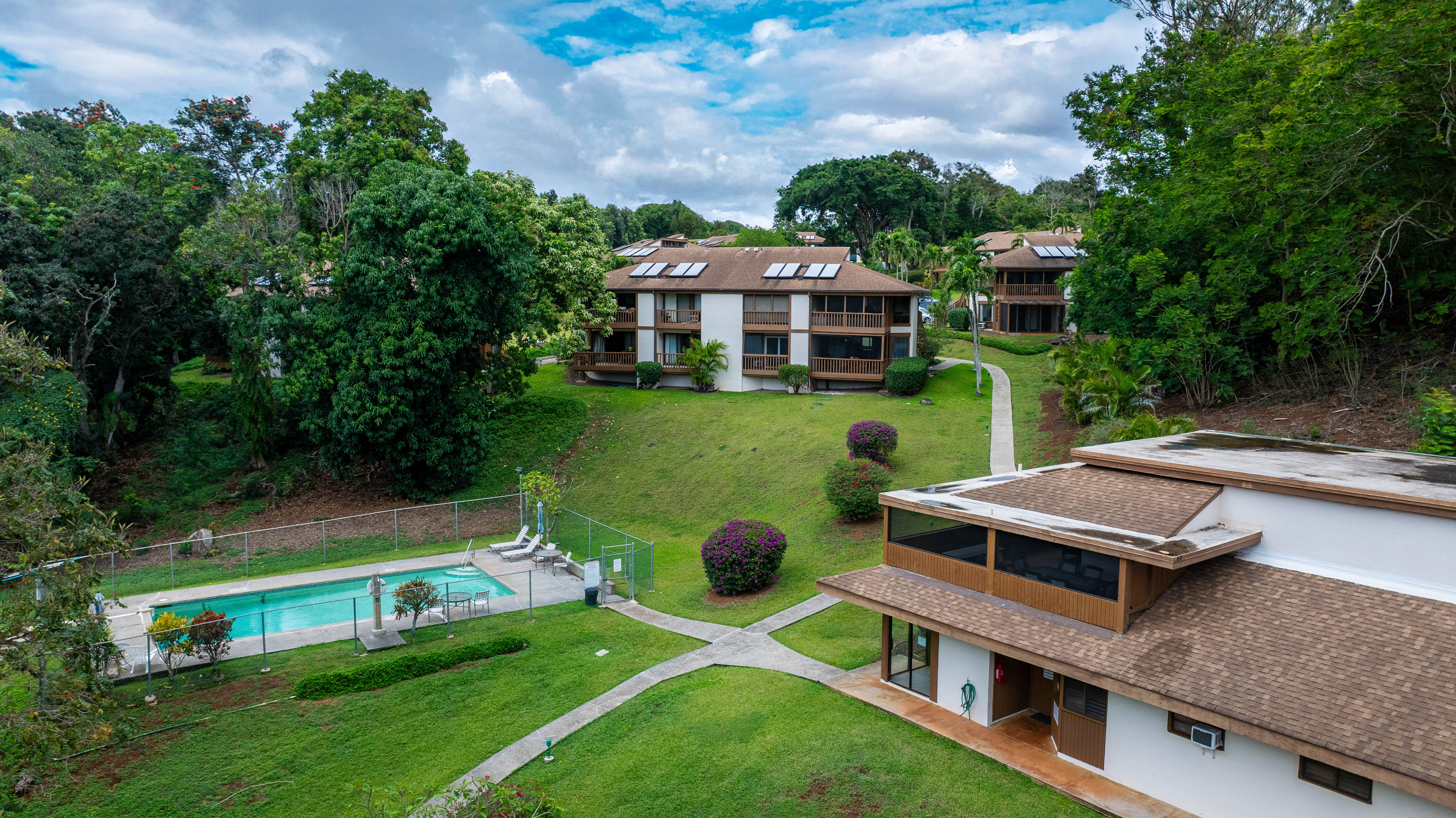 4701 Kawaihau Road, Unit L201 Kapaa, HI 96746 - Photo 28 of 29 a view of a house with a big yard and large trees