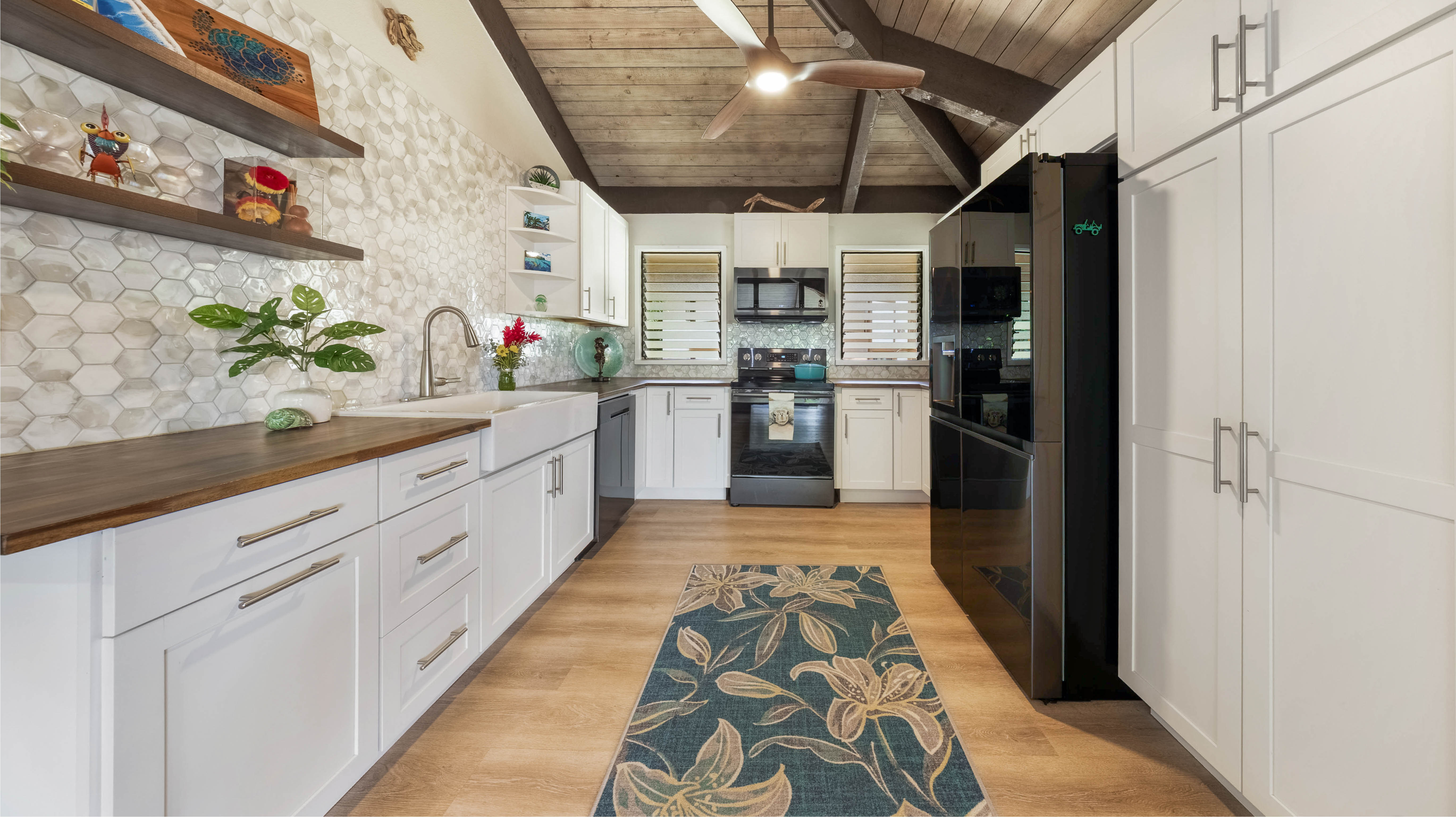4701 Kawaihau Road, Unit L201 Kapaa, HI 96746 - Photo 4 of 29 a large kitchen with stainless steel appliances granite countertop lots of counter top space