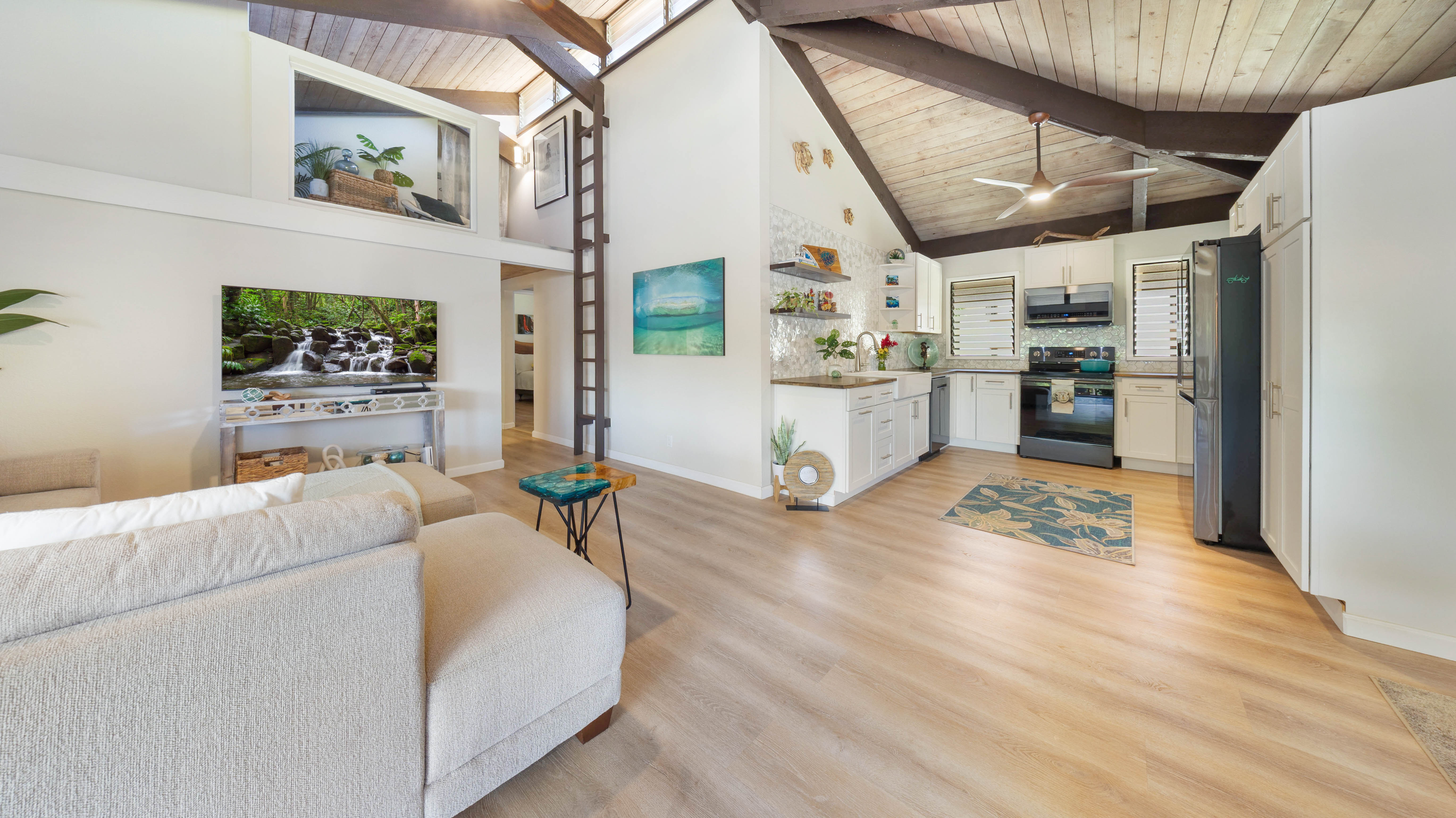 4701 Kawaihau Road, Unit L201 Kapaa, HI 96746 - Photo 9 of 29 a living room with stainless steel appliances furniture and a kitchen view