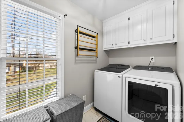 a utility room with dryer and washer