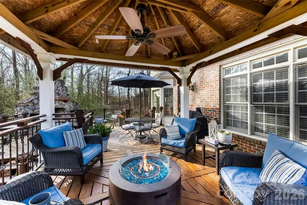 a outdoor space with patio the couches and a dining table with the view of garden