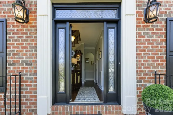 a view of a brick house with a large window
