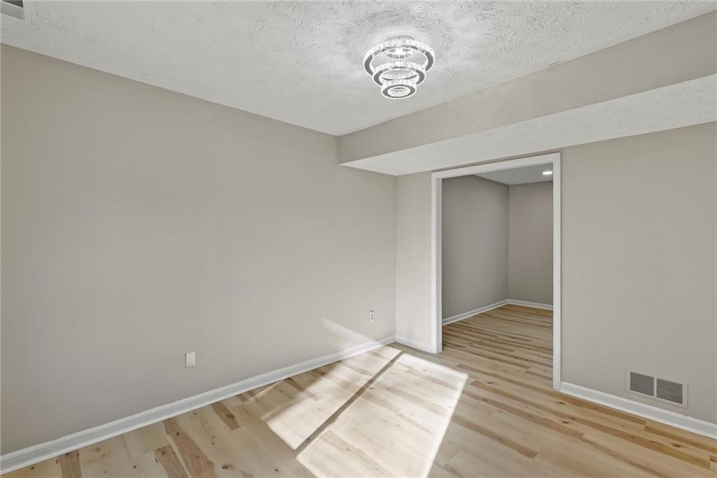 3428 Runelle Place Southwest Lilburn, GA 30047 - Photo 14 of 36 a view of an empty room