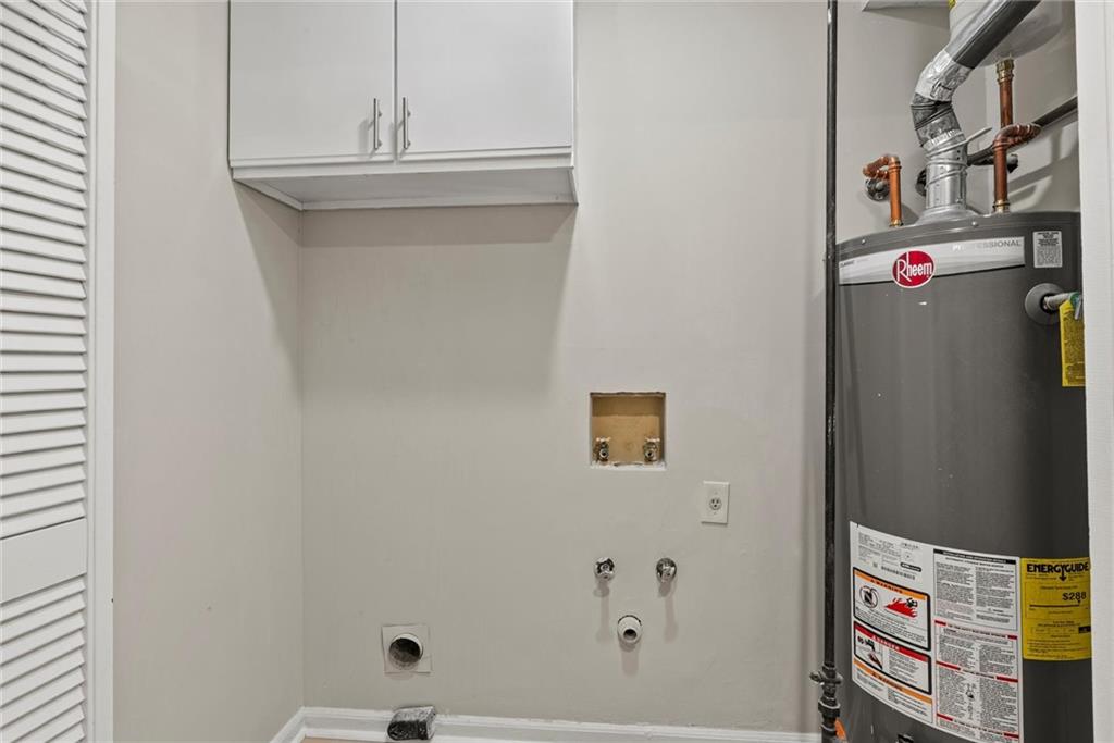 3428 Runelle Place Southwest Lilburn, GA 30047 - Photo 15 of 36 a utility room with dryer and washer