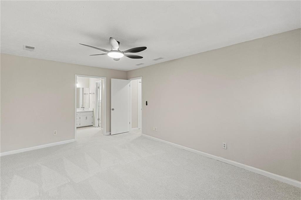 3428 Runelle Place Southwest Lilburn, GA 30047 - Photo 20 of 36 wooden floor in an empty room
