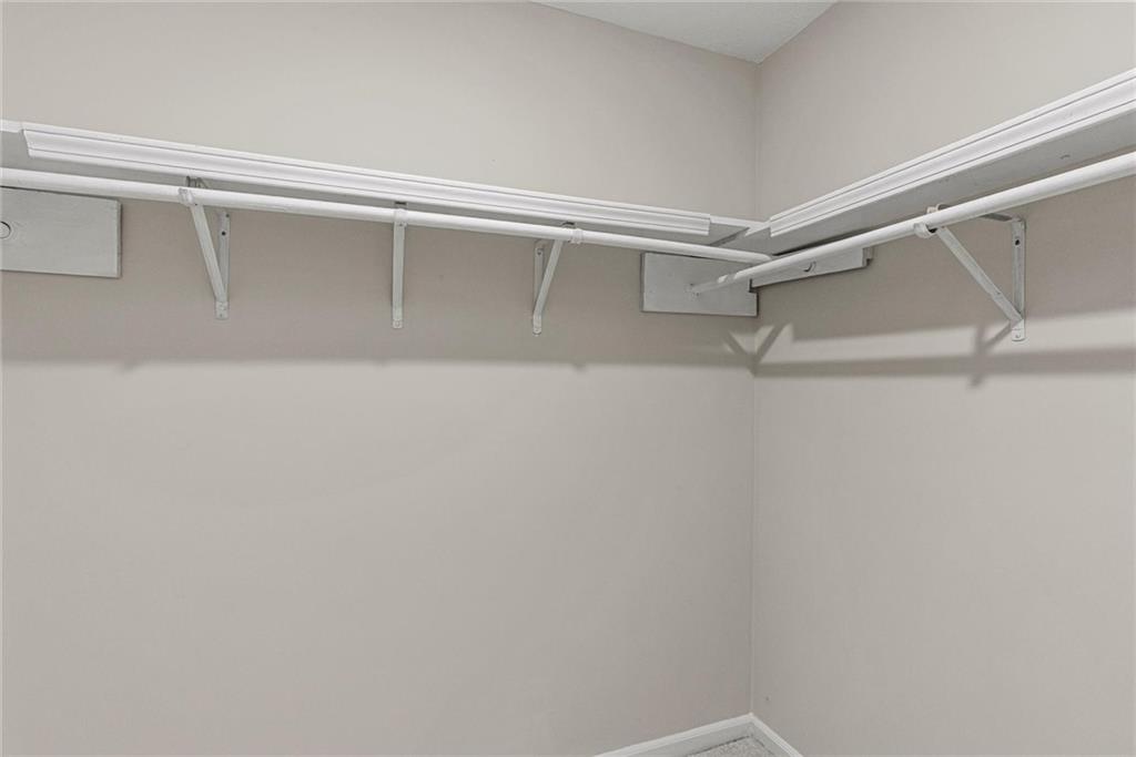 3428 Runelle Place Southwest Lilburn, GA 30047 - Photo 22 of 36 a view of an empty walk in closet