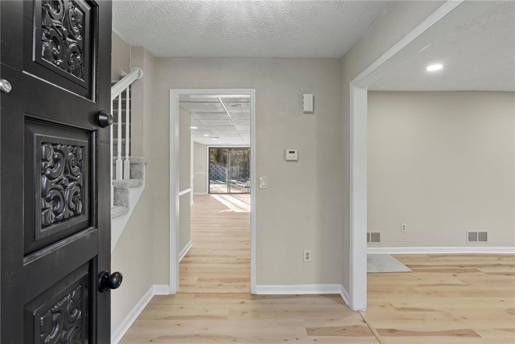 3428 Runelle Place Southwest Lilburn, GA 30047 - Photo 9 of 36 a view of a hallway with interior of the house