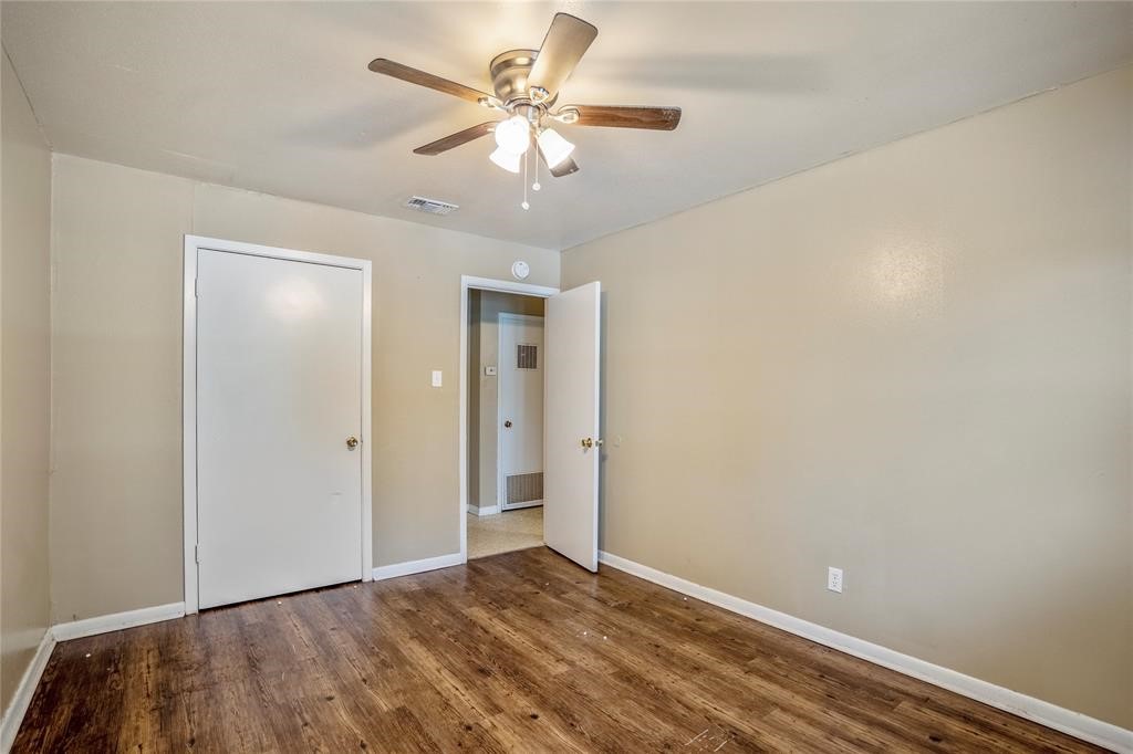 3532 Midwest Drive, Unit B Bryan, TX 77802 - Photo 4 of 21 wooden floor in an empty room