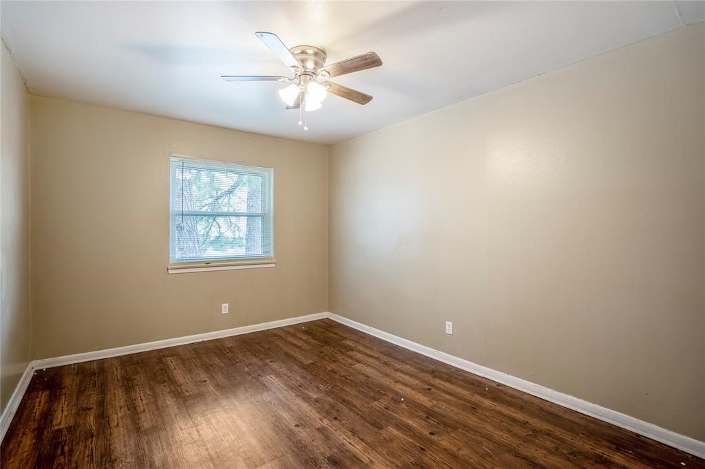 3532 Midwest Drive, Unit B Bryan, TX 77802 - Photo 5 of 21 an empty room with a window