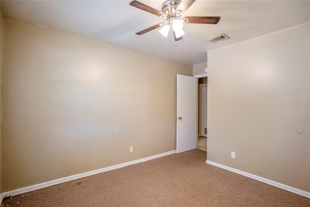 3532 Midwest Drive, Unit B Bryan, TX 77802 - Photo 6 of 21 an empty room with a fan and a fan