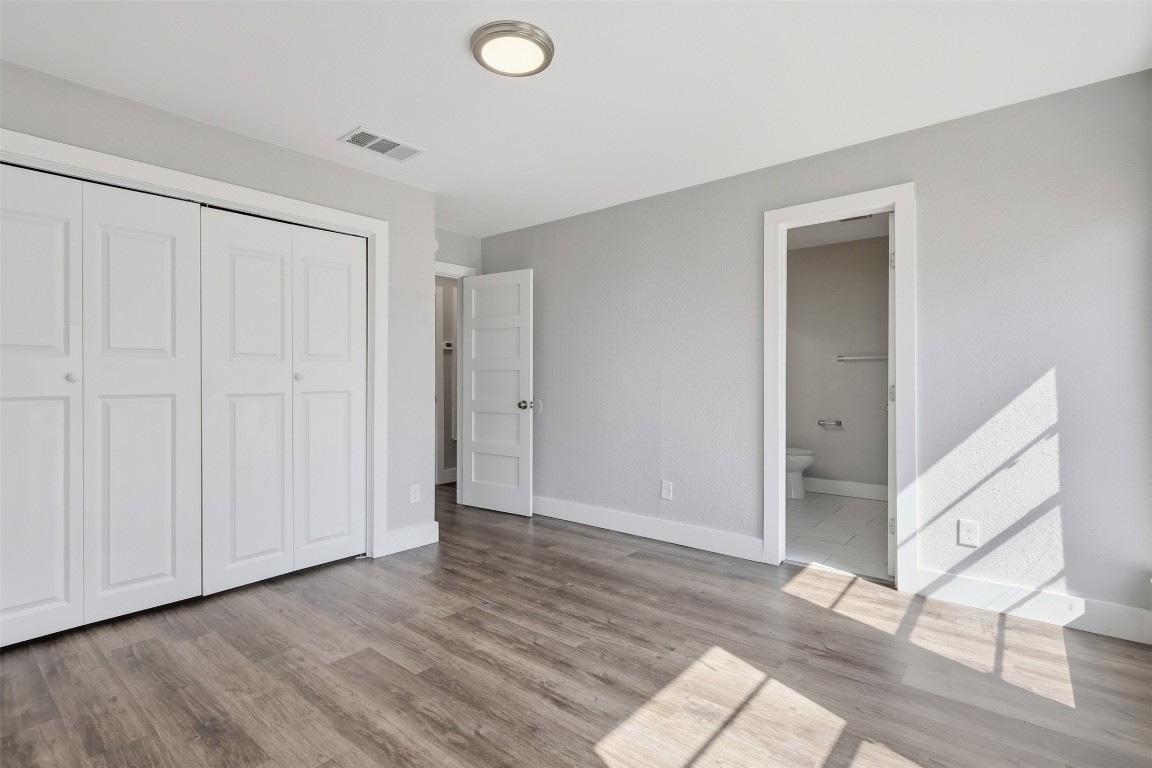 5106 Nuckols Crossing Road, Unit B Austin, TX 78744 - Photo 4 of 8 a view of an empty room and wooden floor