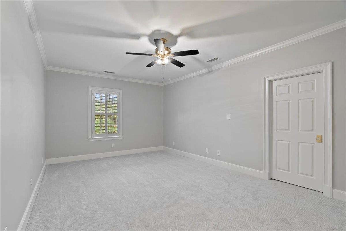425 River Oaks Road Memphis, TN 38120 - Photo 30 of 39 an empty room with windows and fan