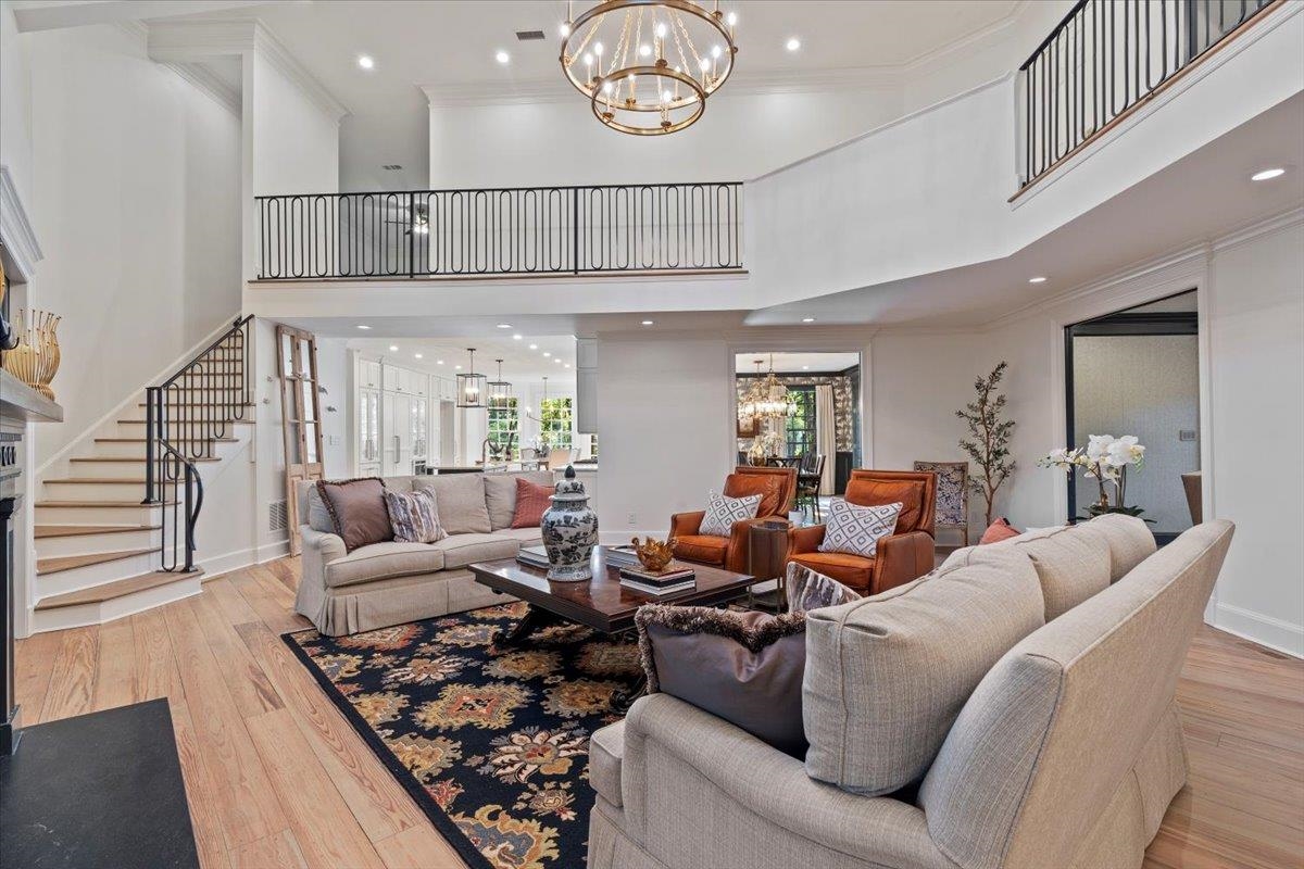 425 River Oaks Road Memphis, TN 38120 - Photo 5 of 39 a living room with furniture a rug and a clock