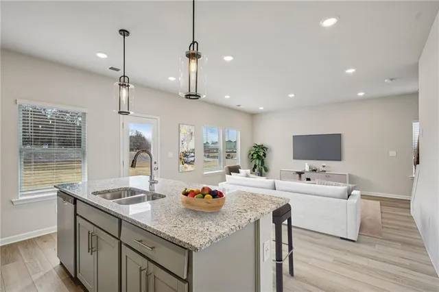 a kitchen with a sink a counter top space and appliances