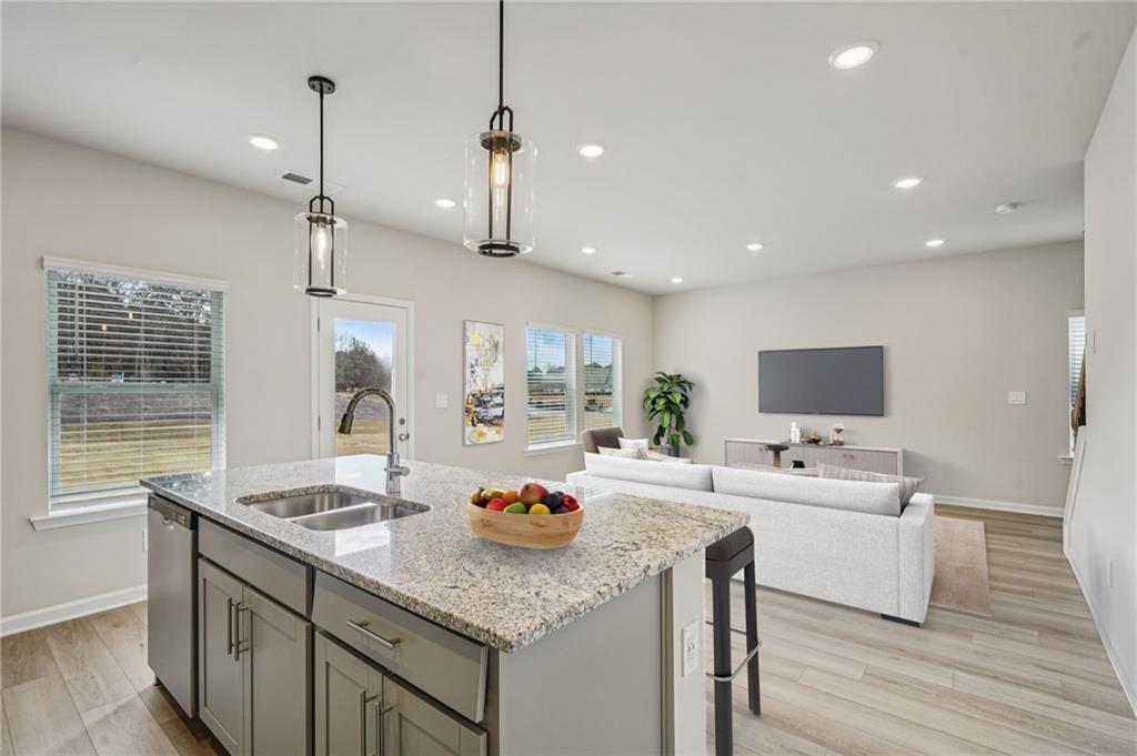 2004 Nolan Way Conyers, GA 30013 - Photo 11 of 23 a kitchen with a sink a counter top space and appliances