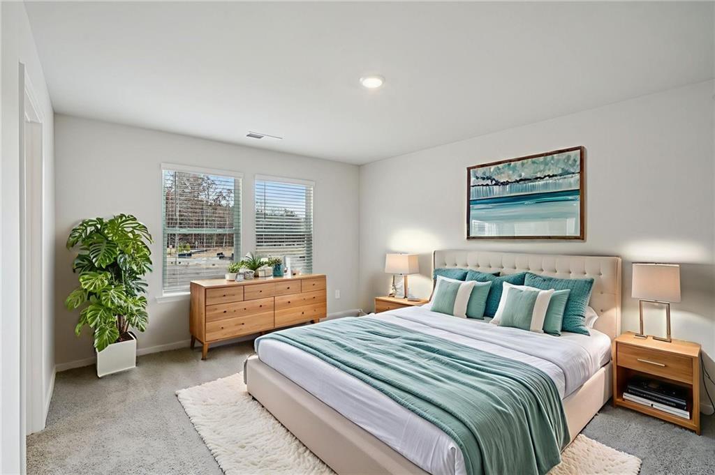 2004 Nolan Way Conyers, GA 30013 - Photo 16 of 23 a bedroom with a bed and a large window