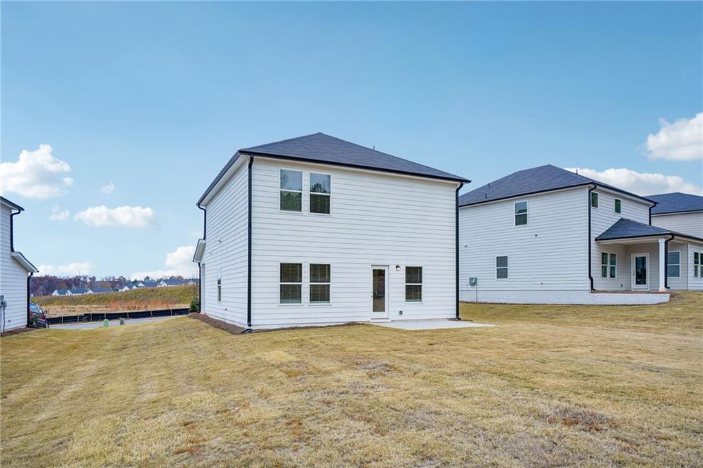 2004 Nolan Way Conyers, GA 30013 - Photo 22 of 23 a view of a house with backyard