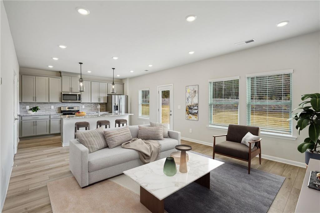2004 Nolan Way Conyers, GA 30013 - Photo 4 of 23 a living room with furniture and a large window