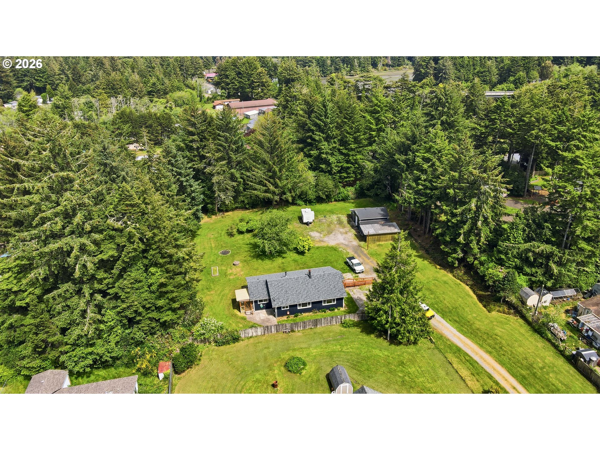 63299 Wildahl Road Coos Bay, OR 97420 - Photo 1 of 45 a open area with trees in the background