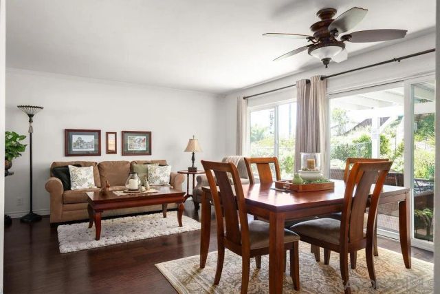 a open kitchen with stainless steel appliances granite countertop a stove top oven a sink dishwasher and cabinets with wooden floor