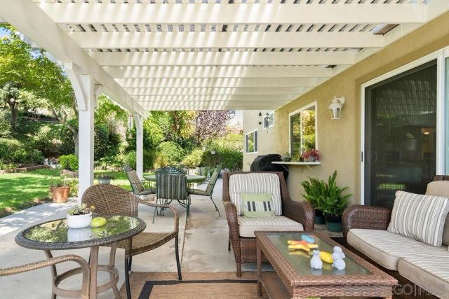 a view of an chairs and table in the balcony