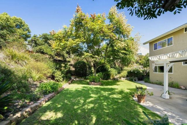 a bedroom with a bed and a large mirror