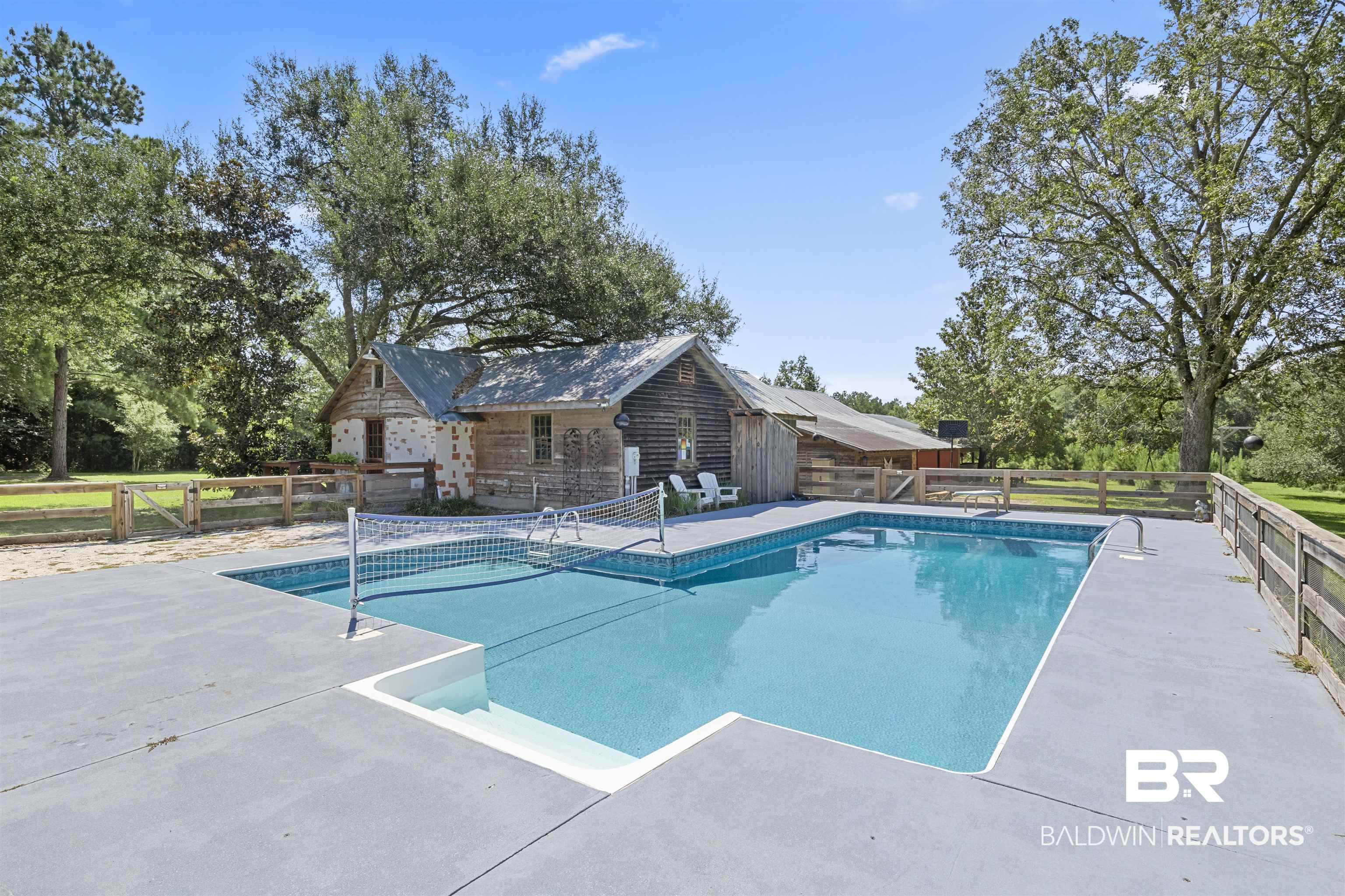 15100 Vasko Road Silverhill, AL 36576 - Photo 45 of 51 View of saltwater pool with removable volleyball net