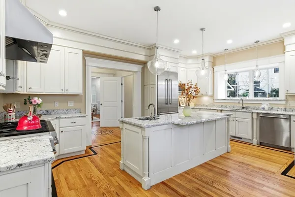 a kitchen with a sink stove and cabinets