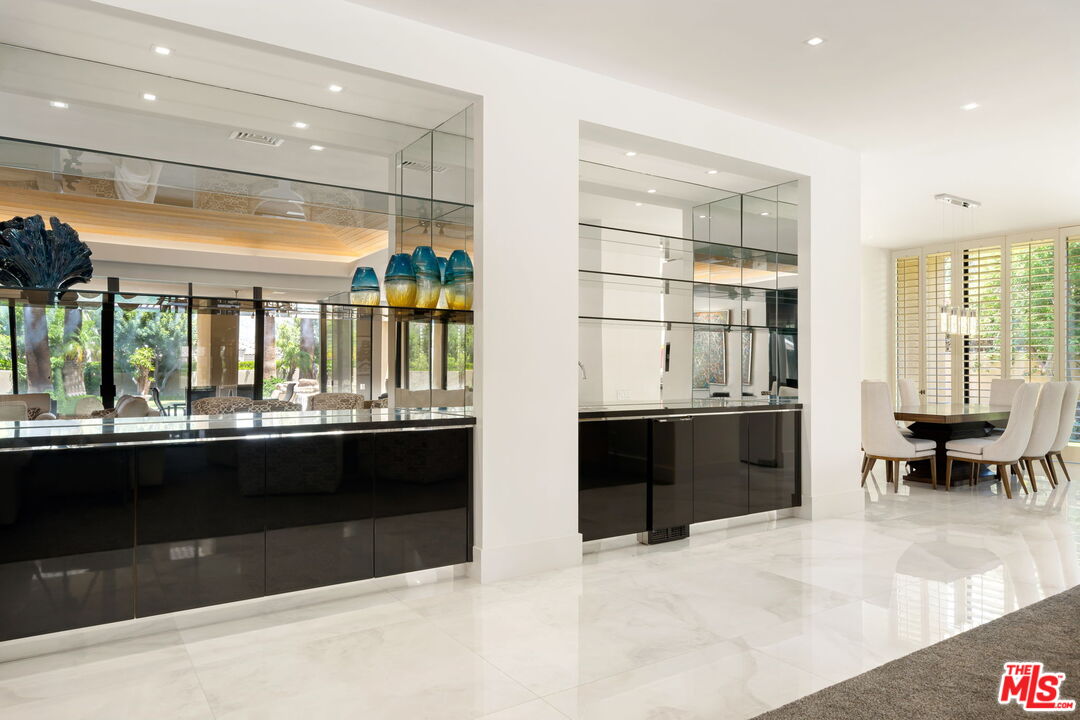 40590 Morningstar Road Rancho Mirage, CA 92270 - Photo 11 of 39 a living room with stainless steel appliances granite countertop a stove and a refrigerator