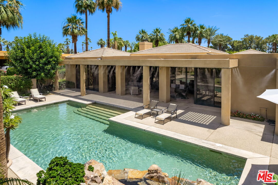 40590 Morningstar Road Rancho Mirage, CA 92270 - Photo 19 of 39 a view of a chair and table in backyard of the house