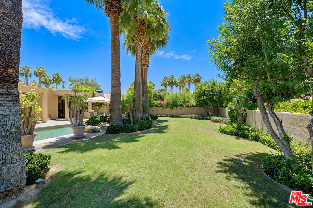 40590 Morningstar Road Rancho Mirage, CA 92270 - Photo 21 of 39 a house with palm tree in front of it