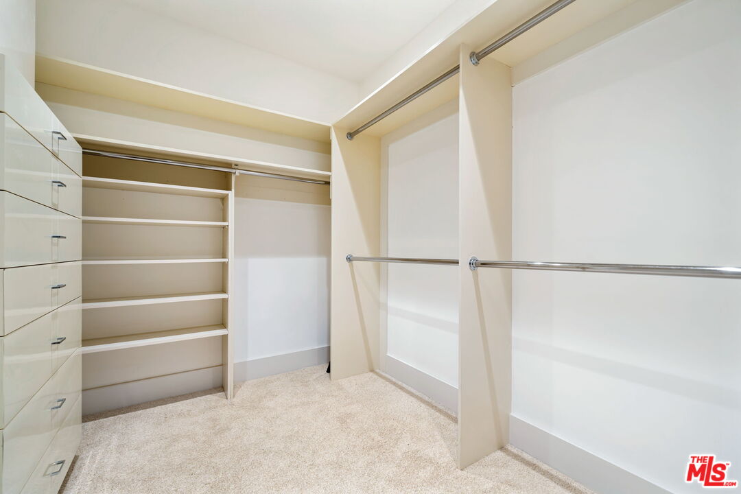 40590 Morningstar Road Rancho Mirage, CA 92270 - Photo 29 of 39 a view of walk in closet with empty racks