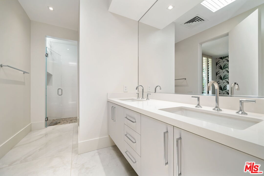 40590 Morningstar Road Rancho Mirage, CA 92270 - Photo 31 of 39 a bathroom with a sink double vanity and a mirror