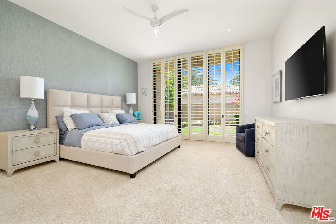40590 Morningstar Road Rancho Mirage, CA 92270 - Photo 32 of 39 a bed room with a bed and a television