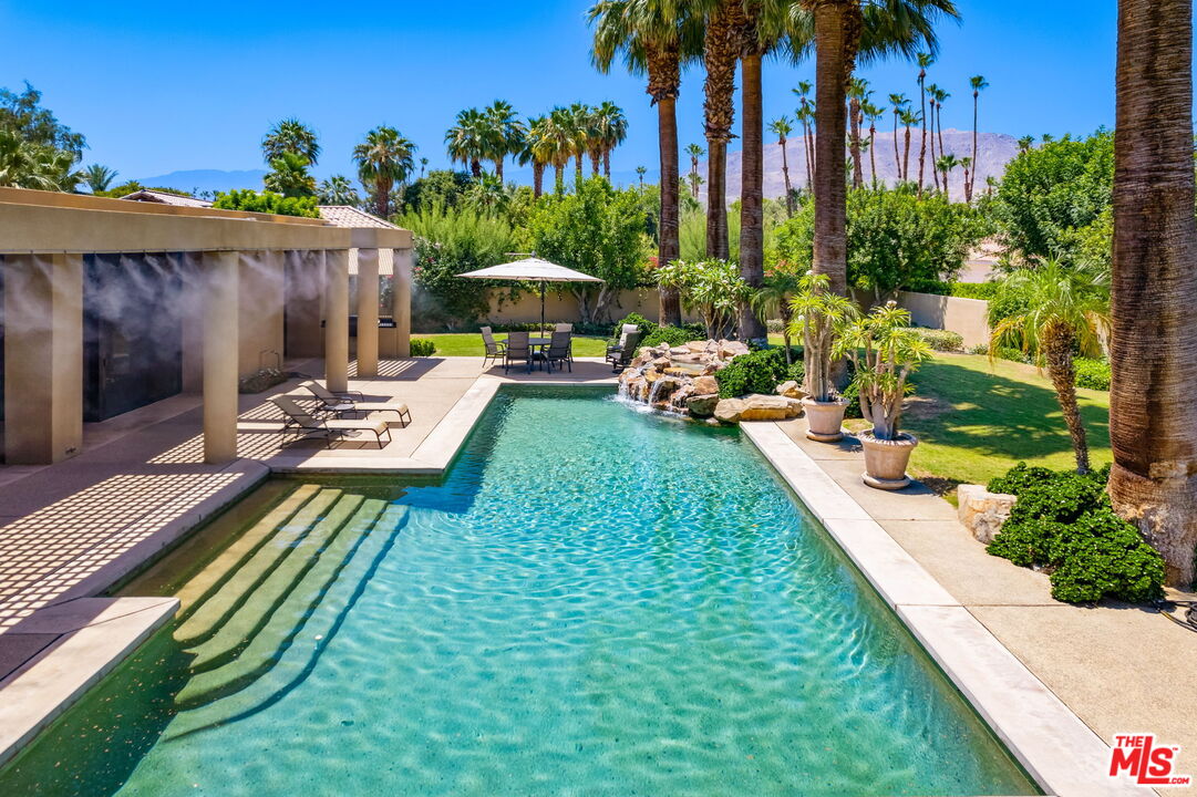40590 Morningstar Road Rancho Mirage, CA 92270 - Photo 5 of 39 a view of a backyard with chairs and potted plants