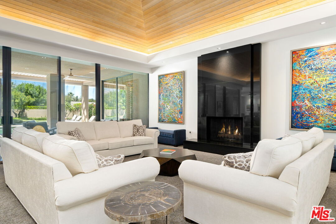 40590 Morningstar Road Rancho Mirage, CA 92270 - Photo 9 of 39 a living room with furniture and a flat screen tv
