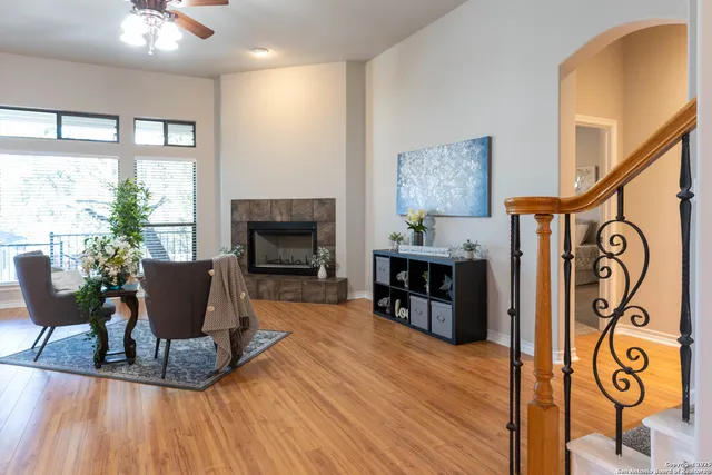 a living room with furniture and a fireplace
