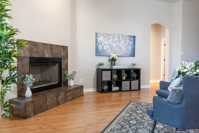 a living room with furniture and a fireplace