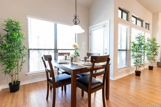 a view of a dining room with furniture and wooden floor