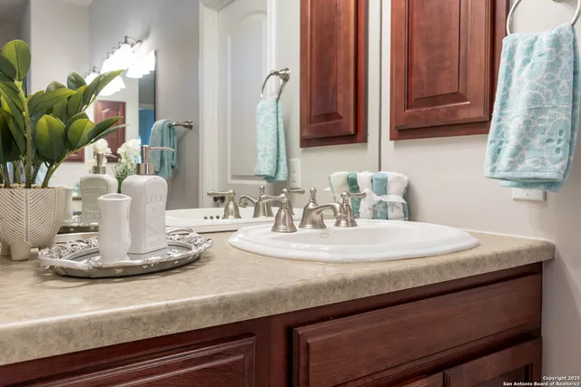 a spacious bathroom with a tub shower and sink