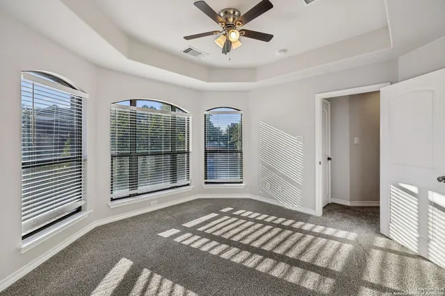a bathroom with a sink a toilet a mirror a bathtub and shower